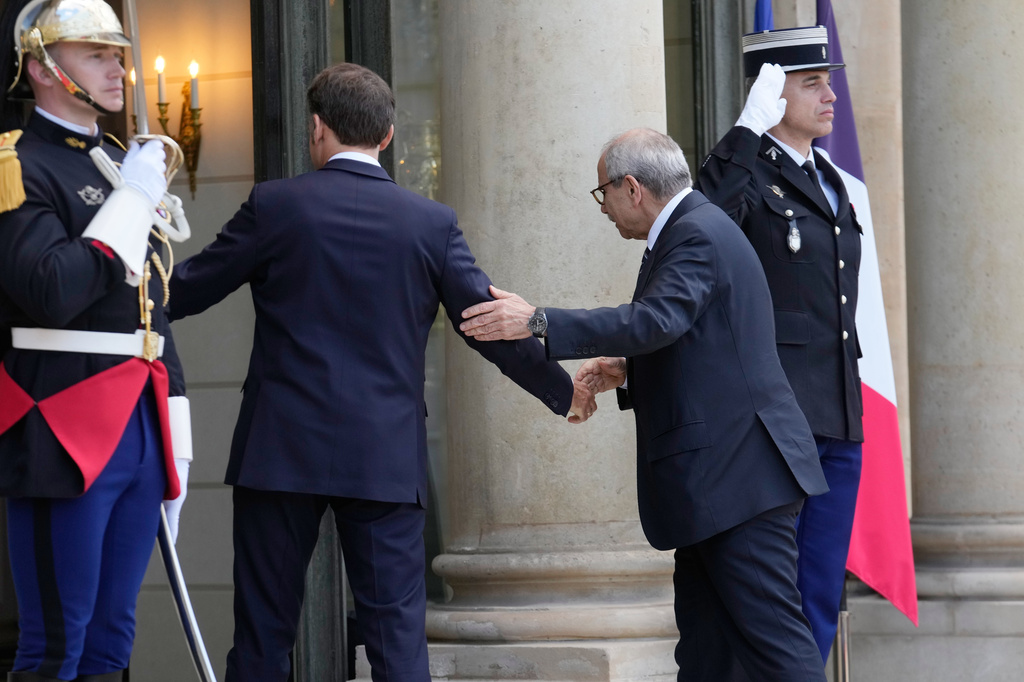 France's President Emmanuel Macron, left, welcomes Lebanon's Prime Minister Nawaf Salam for a meeting at the Elysee Palace in Paris, Tuesday, April 21, 2026. (AP PhotoMichel Euler)