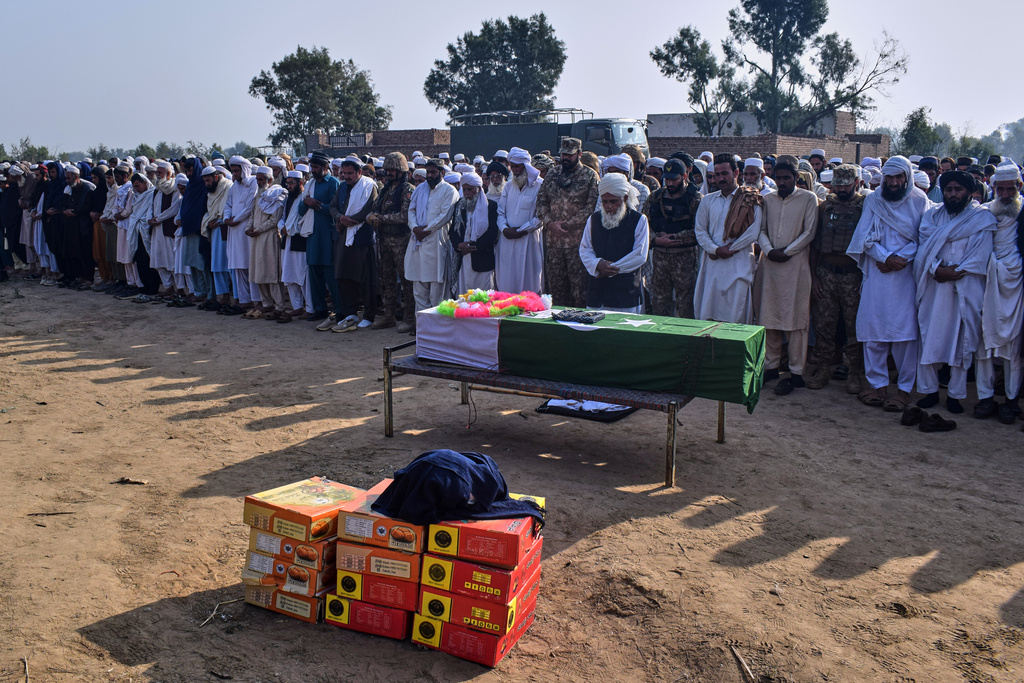 People attend funeral prayer of an army soldier, killed in the cross-border clashes of Pakistan and Afghan forces, at a village in Lakki Marwat, a district of Pakistan's Khyber Pakhtunkhwa province, Saturday, Feb. 28, 2026. (AP Photo/G.A. Marwat)