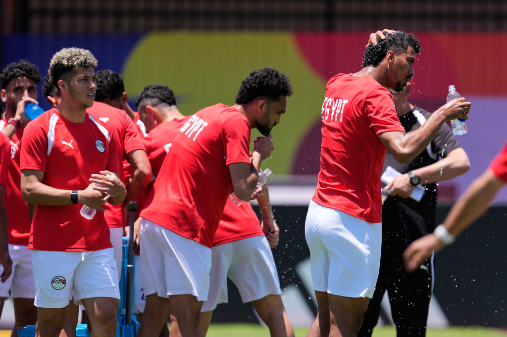 Egypt players hydrate and cool down as the weather nears triple digits during a training session in Dallas, Thursday, July 2, 2026, ahead of the team's World Cup soccer match against Australia. (AP Photo/Tony Gutierrez)