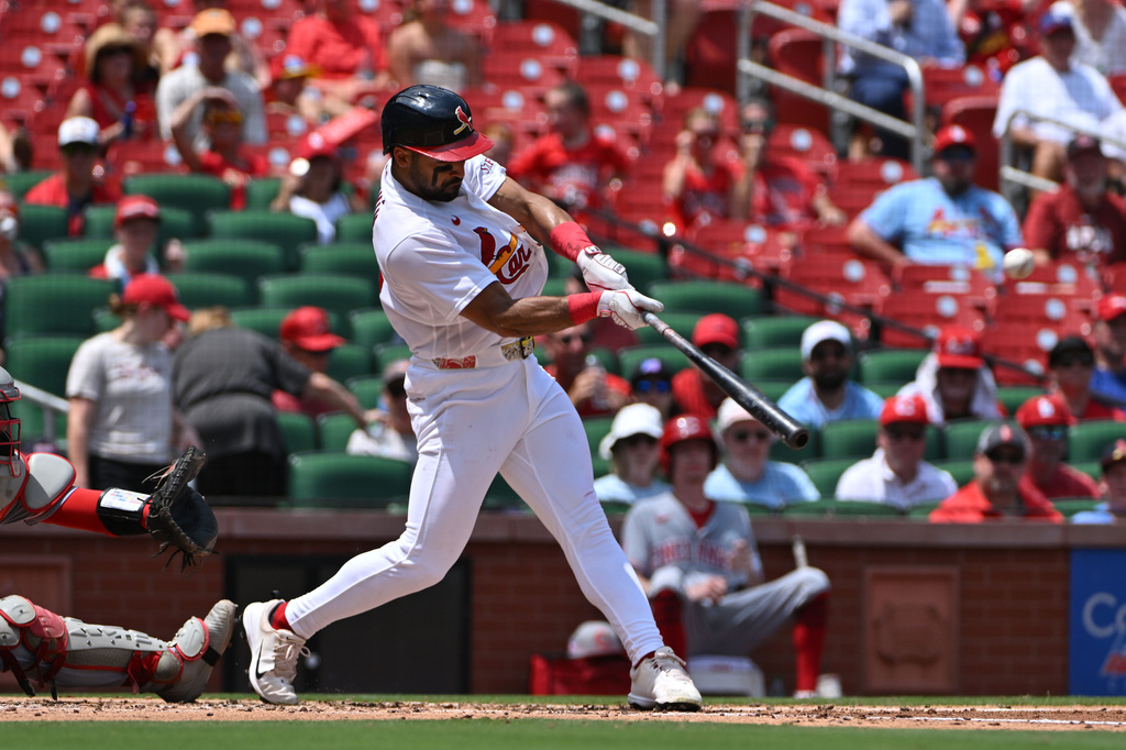 St. Louis Cardinals' José Fermín is hits a sacrifice fly to score Alec Burleson during the second inning of a baseball game against the Cincinnati Reds, Sunday, July 26, 2026, in St. Louis. (AP Photo/Jeff Le)
