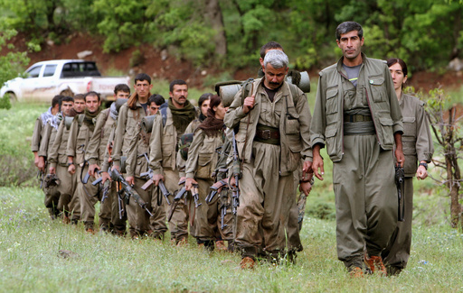 FILE - A group of armed Kurdish fighters from the Kurdistan Workers Party (PKK) enter northern Iraq in the Heror area, northeast of Dahuk, 260 miles (430 kilometers) northwest of Baghdad, Iraq, May 14, 2013. (AP Photo/Ceerwan Aziz, File) FILE - A group of armed Kurdish fighters from the Kurdistan Workers Party (PKK) enter northern Iraq in the Heror area, northeast of Dahuk, 260 miles (430 kilometers) northwest of Baghdad, Iraq, May 14, 2013. (AP Photo/Ceerwan Aziz, File)