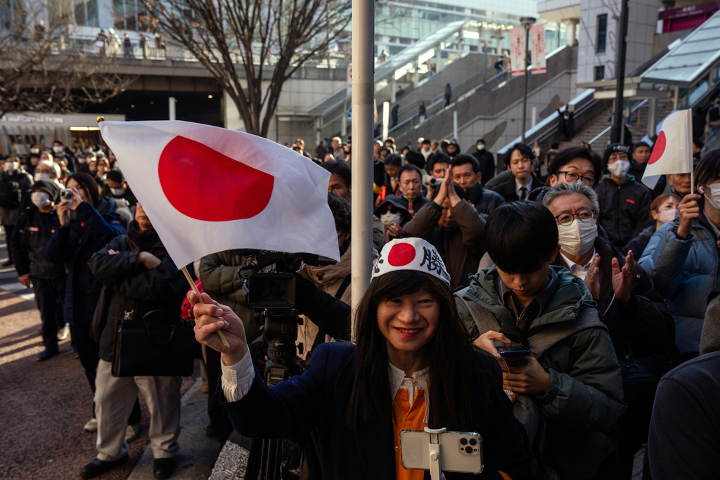 FILE - People attend a campaign event for Japan's far-right Sanseito party ahead of the lower house election in Tokyo, Tuesday, Jan. 27, 2026. (AP Photo/Louise Delmotte, File)
