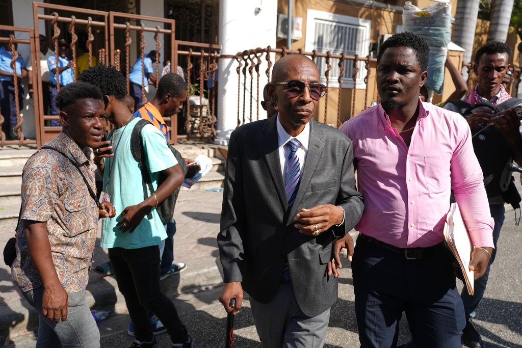 Political leader Rene Civil leaves after registering his political party, Patriotic Emergence, at the Provisional Electoral Council in the Petion-Ville neighborhood of Port-au-Prince, Haiti, Thursday, March 12, 2026. (AP Photo/Odelyn Joseph)