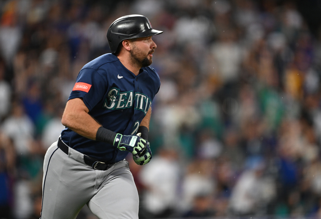 Seattle Mariners catcher Cal Raleigh watches his two-run home run during the first inning against the Colorado Rockies during a baseball game Saturday, Sept. 19, 2026, in Denver. (AP Photo/RJ Sangosti)
