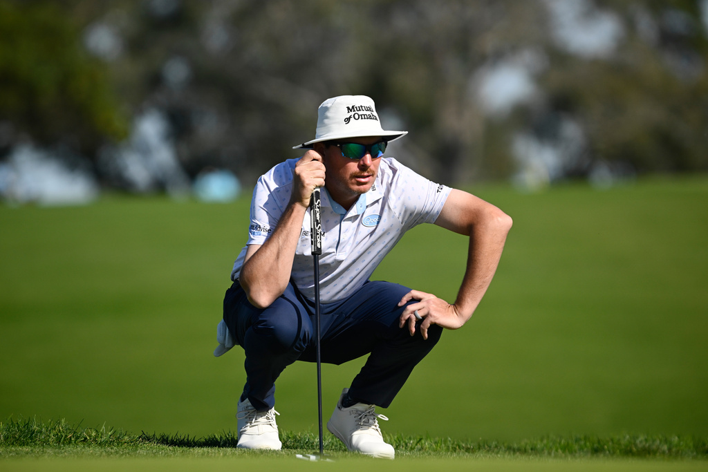 Joel Dahmen lines up his putt on the second green of the South Course at Torrey Pines during the third round of the Farmers Insurance Open golf tournament Saturday, Jan. 31, 2026, in San Diego. (AP Photo/Denis Poroy)