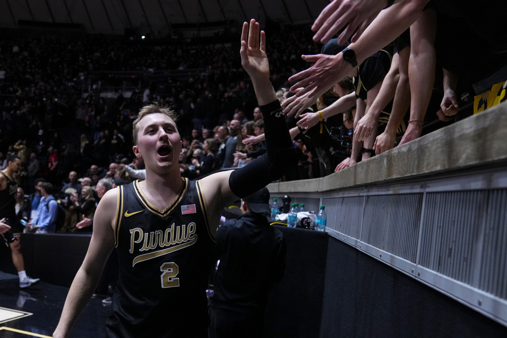 Purdue guard Fletcher Loyer (2) celebrates with fans following an NCAA college basketball game against Indiana in West Lafayette, Ind., Friday, Feb. 20, 2026. (AP Photo/Michael Conroy)