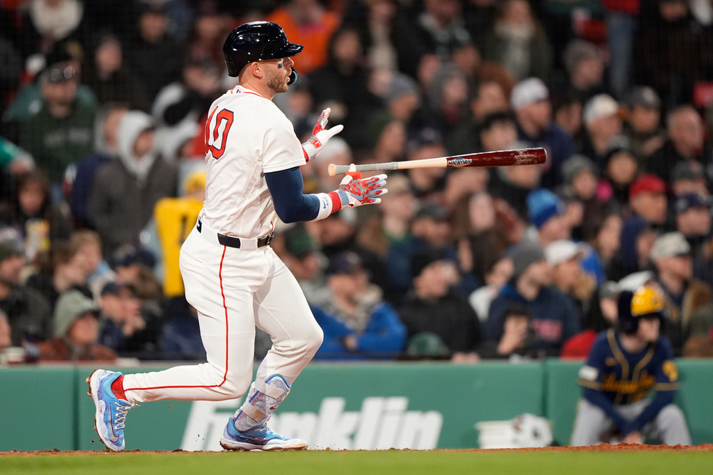 Boston Red Sox shortstop Trevor Story hits a two-run double win the sixth inning of a baseball game against the Milwaukee Brewers Tuesday, April 7, 2026, in Boston. (AP Photo/Robert F. Bukaty)