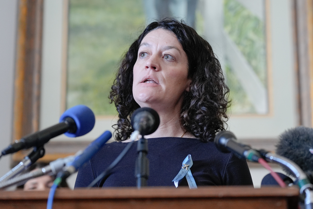 Rachel Feres one of a family members of the people who were killed in the midair collision near Washington Reagan National Airport, speaks during a news conference on Capitol Hill, Tuesday, Feb. 24, 2026, in Washington. (AP Photo/Mariam Zuhaib)