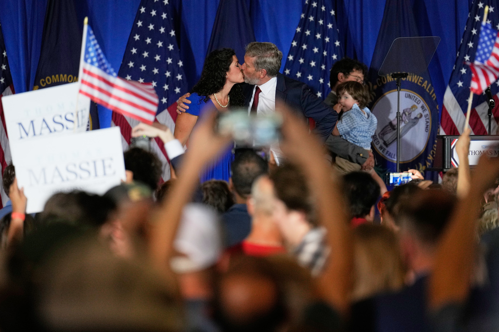 Rep. Thomas Massie, R-Ky., kisses his wife, Carolyn Moffa, during an election night watch party after losing the Republican party's nomination at the Marriott Cincinnati Airport, Tuesday, May 19, 2026, in Hebron, Ky. (AP Photo/Carolyn Kaster)