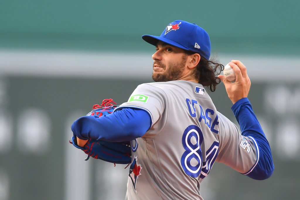 Toronto Blue Jays' Dylan Cease winds up for a pitch to a Boston Red Sox batter in the first inning of a baseball game, Tuesday, June 16, 2026, in Boston. (AP Photo/Steven Senne)