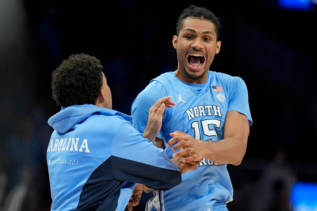 North Carolina forward Jarin Stevenson (15) celebrates victory over North Carolina after an NCAA basketball game, Saturday, Dec. 20, 2025, in Atlanta. (AP Photo/Mike Stewart)