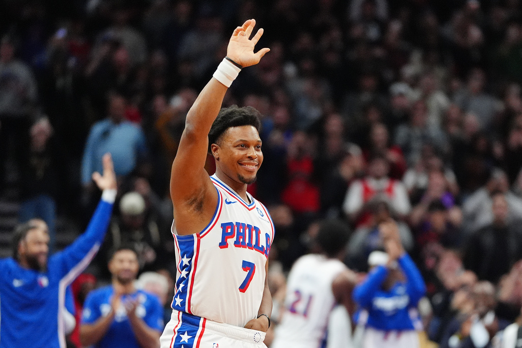 Philadelphia 76ers guard Kyle Lowry (7) acknowledges the fans as he is brought in during the final minutes of an NBA basketball game against his former team, the Toronto Raptors, in Toronto, Monday, Jan. 12, 2026. (Frank Gunn/The Canadian Press via AP)