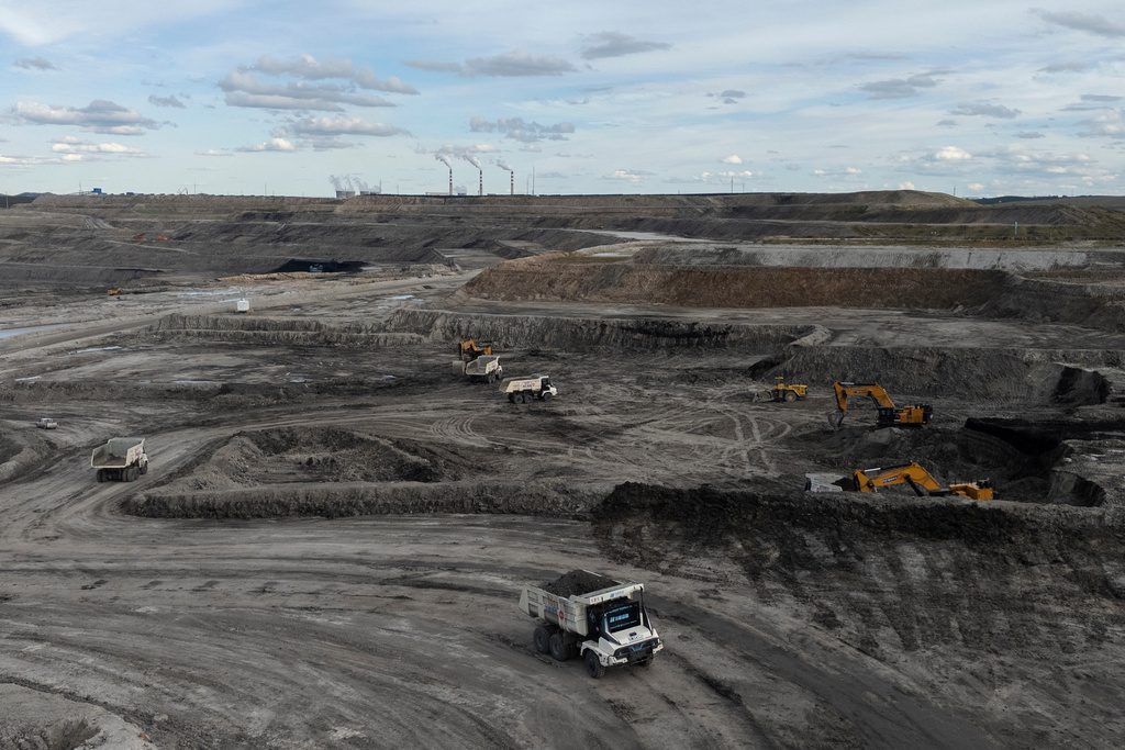 Autonomous mining truck operate the Huaneng Yimin open-pit coal mine in Hulunbuir in northern China's Inner Mongolia province China, Monday, Sept. 15, 2025. (AP Photo/Ng Han Guan)