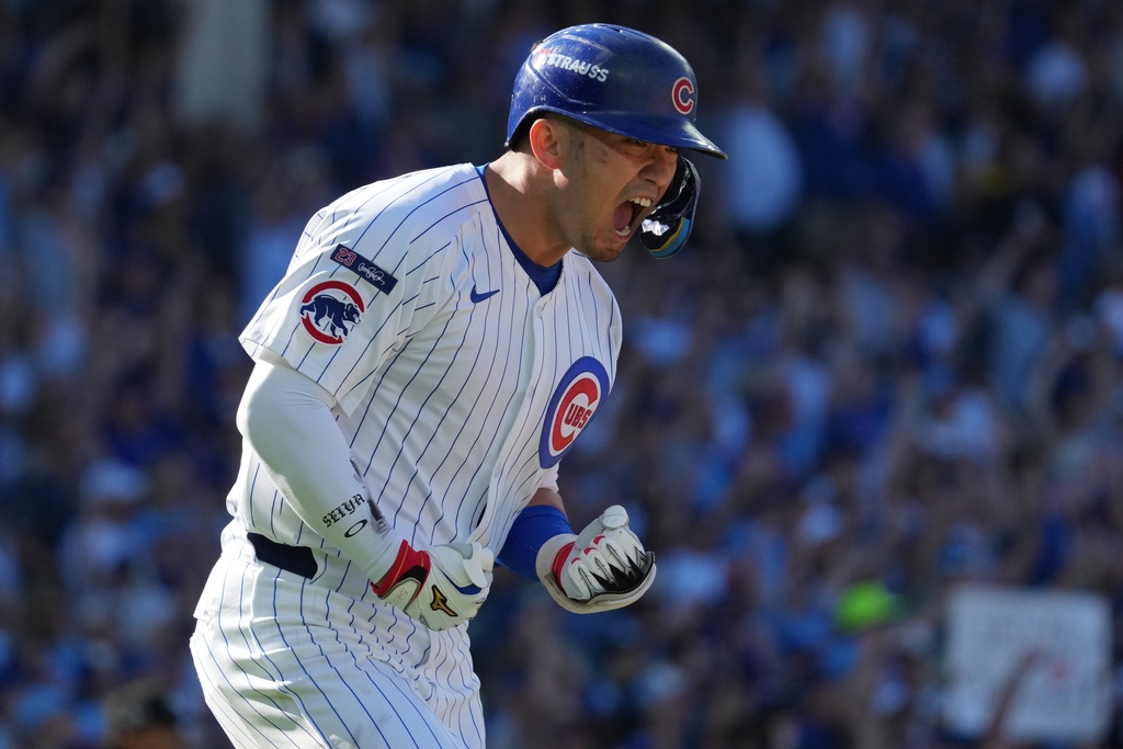 Chicago Cubs' Seiya Suzuki reacts after hitting a home run during the fifth inning of Game 1 of a National League wild card baseball game against the San Diego Padres Tuesday, Sept. 30, 2025, in Chicago. (AP Photo/Nam Huh)