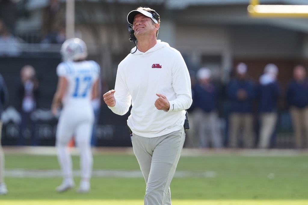 Mississippi head coach Lane Kiffin reacts to a official's call during the second half of an NCAA college football game against Mississippi State, Friday, Nov. 28, 2025, in Starkville, Miss. (AP Photo/Rogelio V. Solis)
