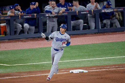 Los Angeles Dodgers' Shohei Ohtani rounds the bases after hitting a two run home run against the Toronto Blue Jays during the seventh inning in Game 1 of baseball's World Series, Friday, Oct. 24, 2025, in Toronto. (AP Photo/David J. Phillip) Los Angeles Dodgers' Shohei Ohtani rounds the bases after hitting a two run home run against the Toronto Blue Jays during the seventh inning in Game 1 of baseball's World Series, Friday, Oct. 24, 2025, in Toronto. (AP Photo/David J. Phillip)
