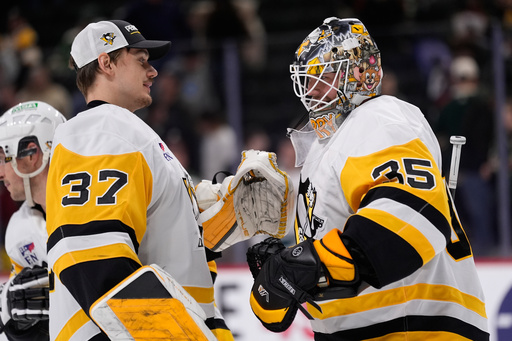 Pittsburgh Penguins goaltender Tristan Jarry (35) hugs Arturs Silovs (37) after an NHL hockey game against the Minnesota Wild, Thursday, Oct. 30, 2025, in St. Paul, Minn. (AP Photo/Abbie Parr) Pittsburgh Penguins goaltender Tristan Jarry (35) hugs Arturs Silovs (37) after an NHL hockey game against the Minnesota Wild, Thursday, Oct. 30, 2025, in St. Paul, Minn. (AP Photo/Abbie Parr)