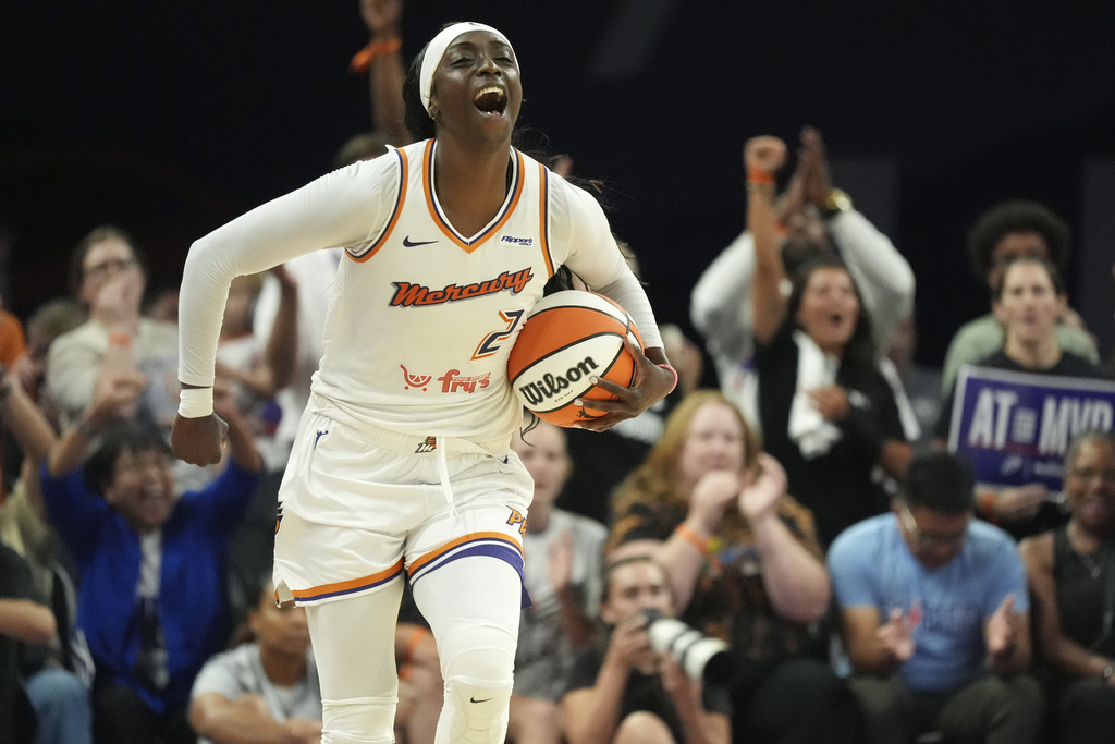 Phoenix Mercury guard Kahleah Copper celebrates a win against the Chicago Sky as time expires in the second half of a WNBA basketball game Thursday, Aug. 28, 2025, in Phoenix. (AP Photo/Ross D. Franklin)