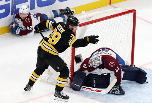 Boston Bruins forward Morgan Geekie reacts after stuffing the puck past Colorado Avalanche goalie Scott Wedgewood to score with five seconds remaining in the second period as Colorado defenseman Josh Manson watches in the background during an NHL hockey game, Saturday, Oct. 25, 2025, in Boston. (AP Photo/Jim Davis) Boston Bruins forward Morgan Geekie reacts after stuffing the puck past Colorado Avalanche goalie Scott Wedgewood to score with five seconds remaining in the second period as Colorado defenseman Josh Manson watches in the background during an NHL hockey game, Saturday, Oct. 25, 2025, in Boston. (AP Photo/Jim Davis)
