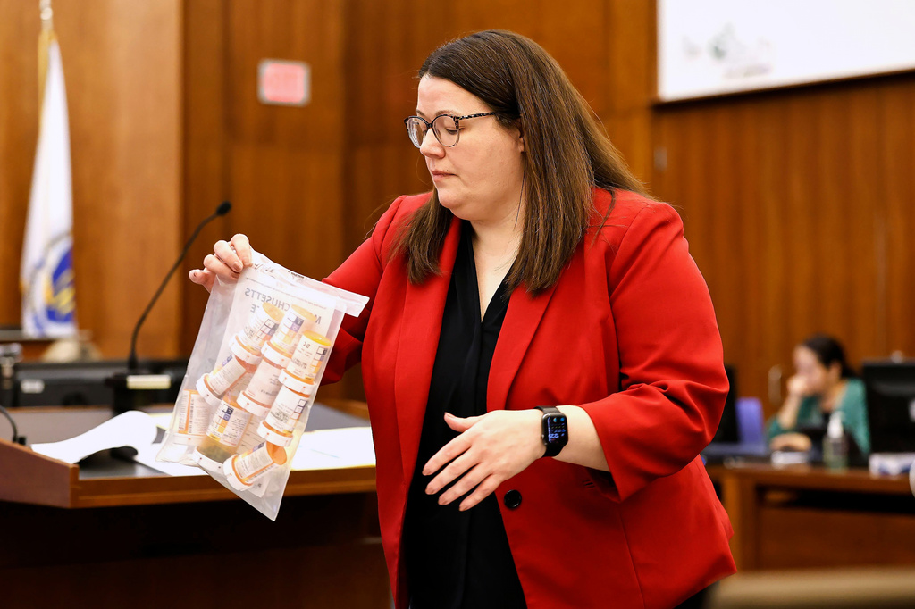 Jennifer Sprague, a prosecutor with the Plymouth County District Attorney's Office, enters a bag of prescription pills as evidence in Lindsay Clancy's trial, Monday, July 27, 2026, at Plymouth Superior Court in Plymouth, Mass. (Greg Derr/The Patriot Ledger via AP, Pool)
