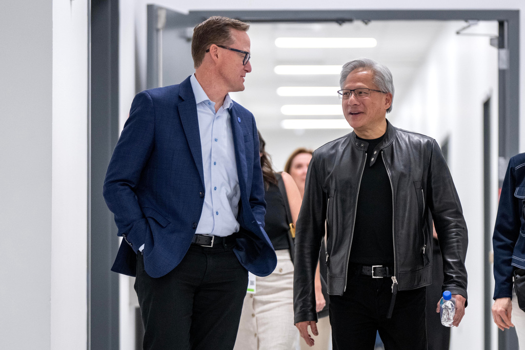 Jensen Huang, right, president and CEO of Nvidia, talks with Jim Anderson, CEO of Coherent, before a groundbreaking ceremony for an expansion of Coherent's manufacturing facility on Tuesday, June 16, 2026, in Sherman, Texas. (AP Photo/Jeffrey McWhorter)