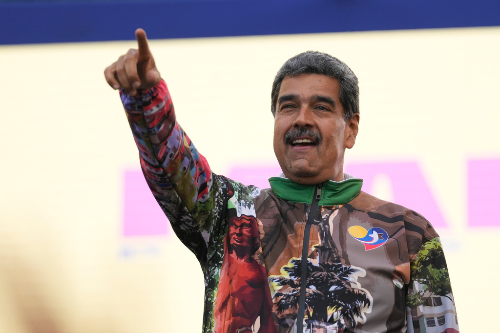 FILE - Venezuelan President Nicolas Maduro points to supporters during a campaign rally in the Catia neighborhood of Caracas, Venezuela, July 18, 2024. (AP Photo/Matias Delacroix, File)