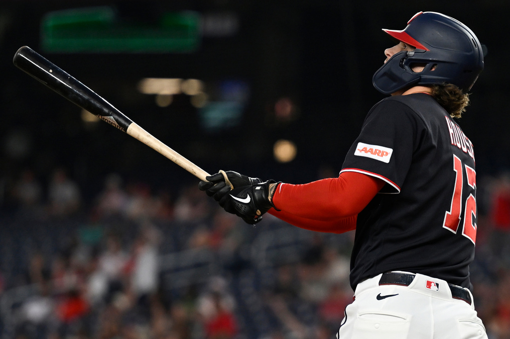 Washington Nationals' Brady House watches his three-run home run to left center field during the third inning of a baseball game against the Miami Marlins, Friday, Aug. 28, 2026, in Washington. (AP Photo/John McDonnell)