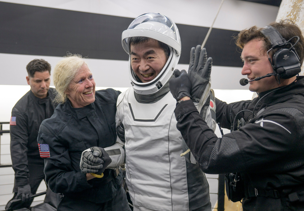 JAXA (Japan Aerospace Exploration Agency) astronaut Kimiya Yui is helped out of the SpaceX Crew-11 capsule after they re-entered the earth in a middle-of-the-night splashdown near San Diego, Calif., Thursday, Jan. 15, 2026. (NASA via AP)