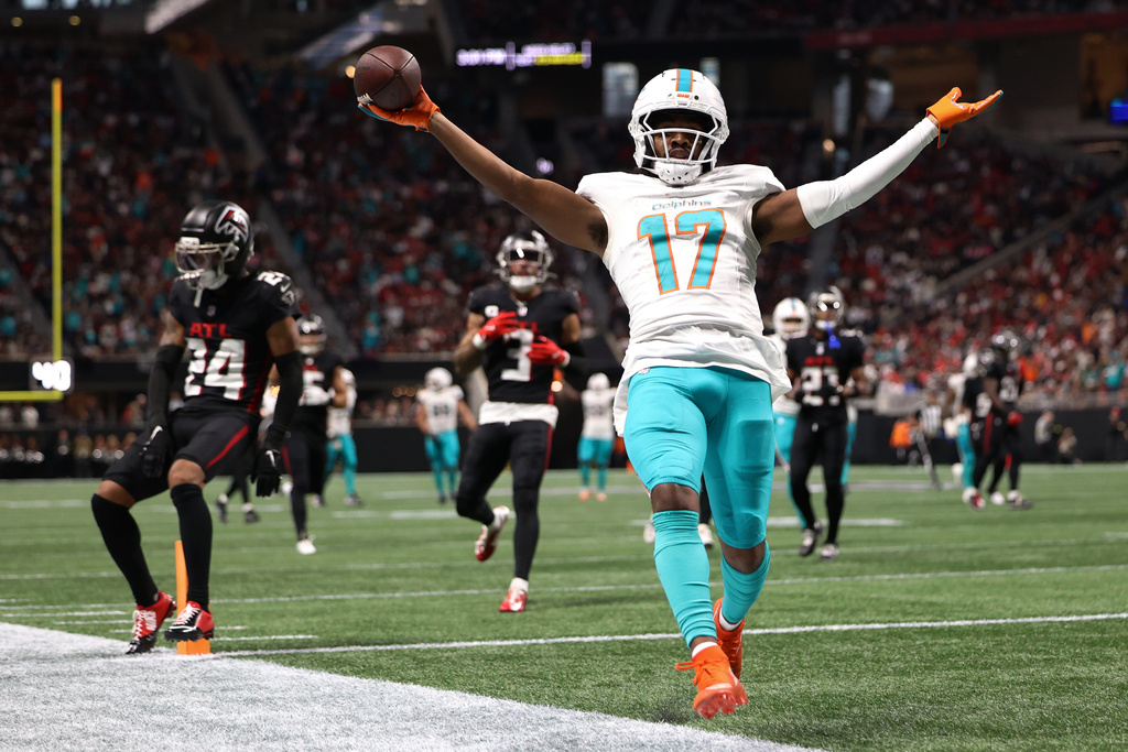 Miami Dolphins wide receiver Jaylen Waddle (17) scores a touchdown during the second half of an NFL football game against the Atlanta Falcons, Sunday, Oct. 26, 2025, in Atlanta. (AP Photo/Colin Hubbard)
