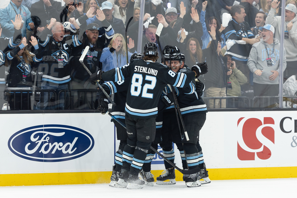 Utah Mammoth celebrate after a goal against the Vegas Golden Knights during the first period of Game 3 of the first round in a NHL hockey Stanley Cup playoff series, Friday, April 24, 2026, in Salt Lake City. (AP Photo/Melissa Majchrzak)