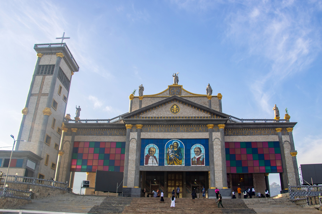 People seen at the St. Joseph Metropolitan Cathedral ahead of Pope Leo XIV's visit in Bamenda, Cameroon, Tuesday, April 14, 2026. (AP Photo/Welba Yamo Pascal)