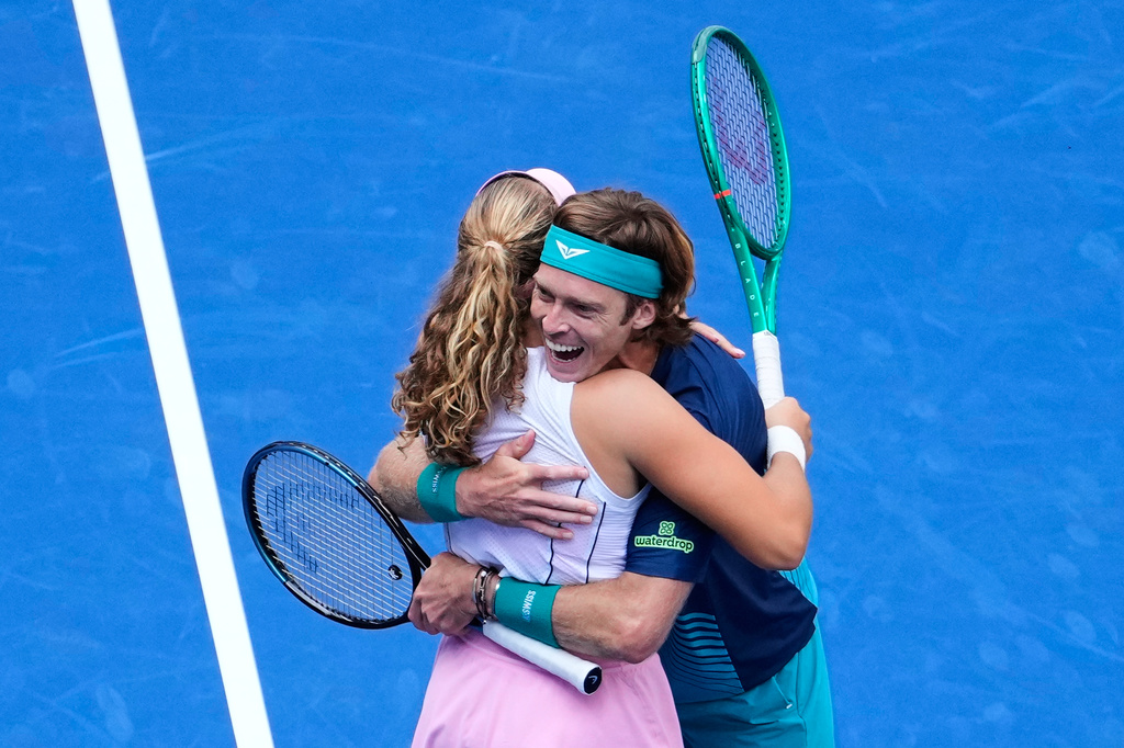 Mirra Andreeva, of Russia, and Andrey Rublev, of Russia, react after winning a mixed doubles match at the U.S. Open tennis championships, Tuesday, Aug. 25, 2026, in New York. (AP Photo/Yuki Iwamura)
