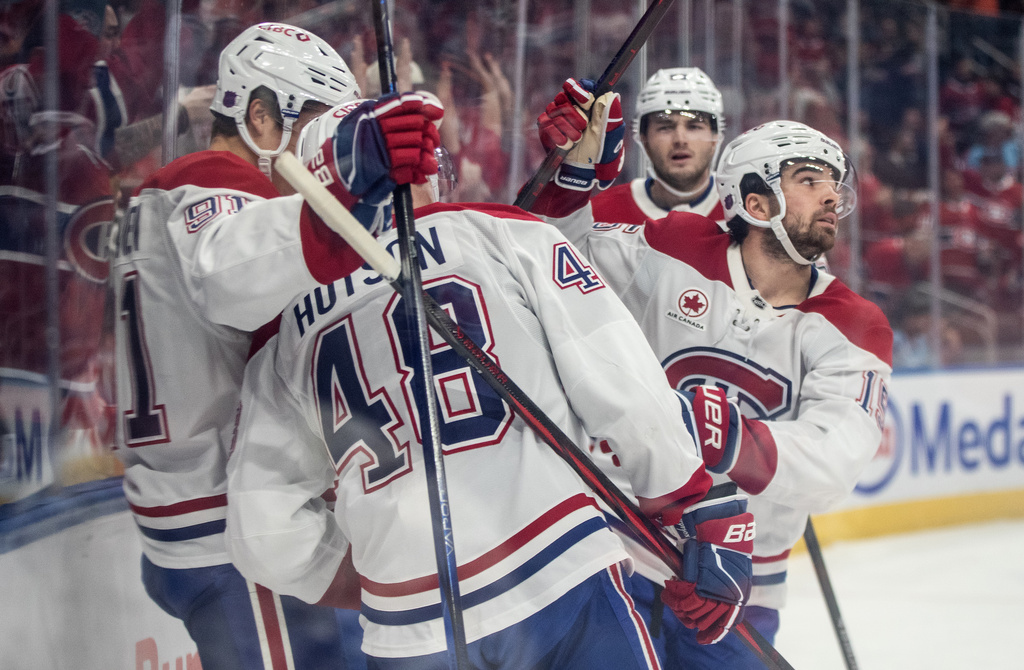 Montreal Canadiens' Alex Newhook (right) celebrates is goal against the Edmonton Oilers with teammates during first period NHL action, in Edmonton on Thursday, Oct. 23, 2025. (Jason Franson/The Canadian Press via AP)