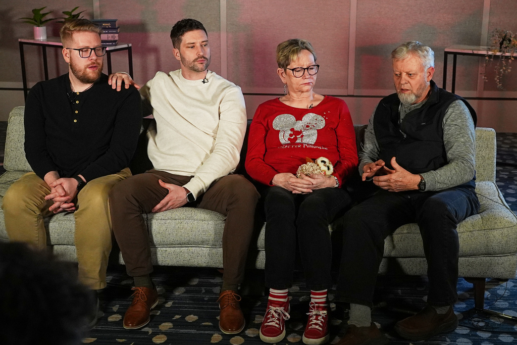 From left, the family of Renee Good, Luke and Brent Ganger, and their parents Donna and Tim Ganger, make a point during an interview in Denver, on Friday, Feb. 27, 2026. (AP Photo/David Zalubowski)