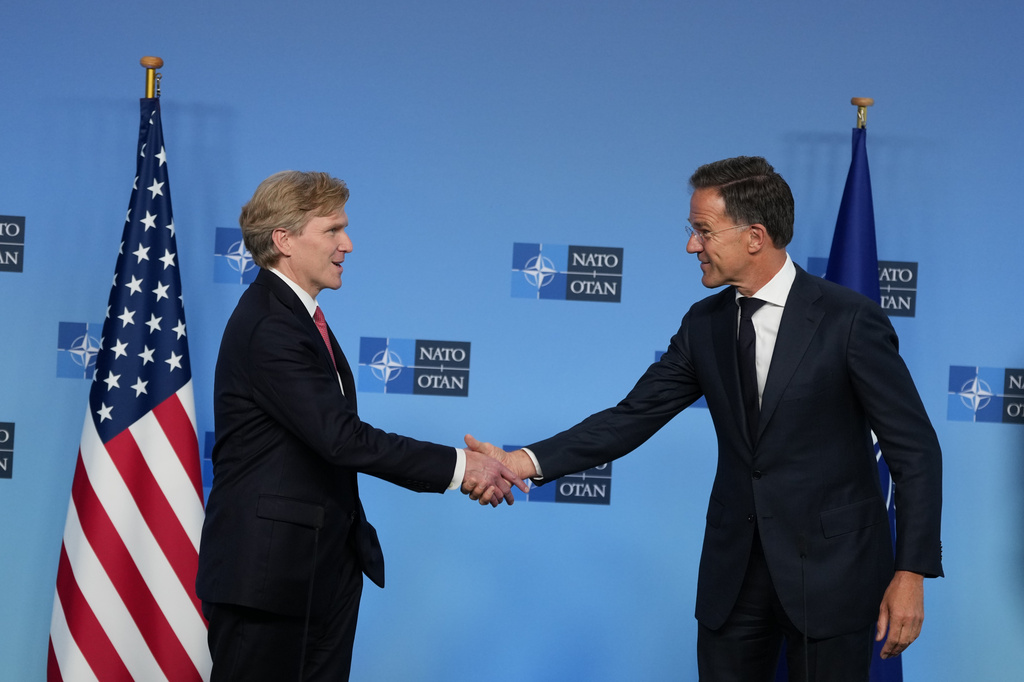 NATO Secretary General Mark Rutte, right, greets United States Undersecretary of Defense Elbridge Colby prior to a meeting at NATO headquarters in Brussels, Thursday, Aug. 27, 2026. (AP Photo/Virginia Mayo)