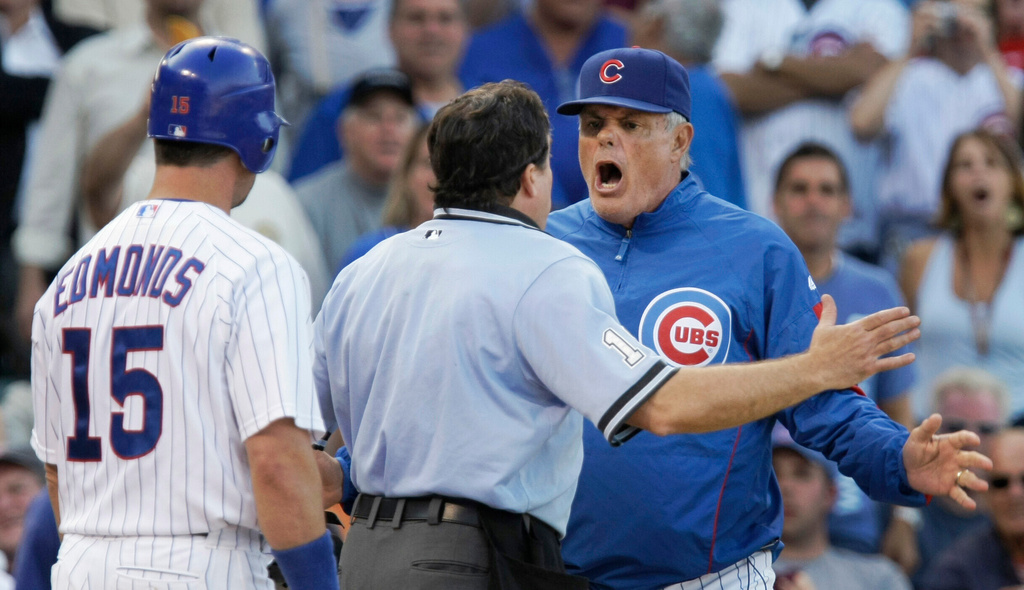 FILE - Chicago Cubs manager Lou Piniella, right, argues with home plate umpire Ed Rapuano after Jim Edmonds, left, was ejected during the 11th inning of a baseball game against the Milwaukee Brewers at Wrigley Field in Chicago, Sept. 18, 2008. (AP Photo/Charles Rex Arbogast, File)