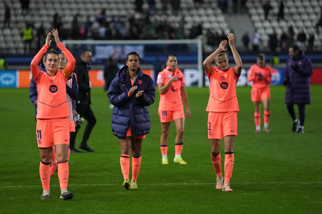 Barcelona players celebrate after a Women's Champions League soccer match between Paris FC and Barcelona in Paris, Wednesday, Dec. 17, 2025. (AP Photo/Thibault Camus)