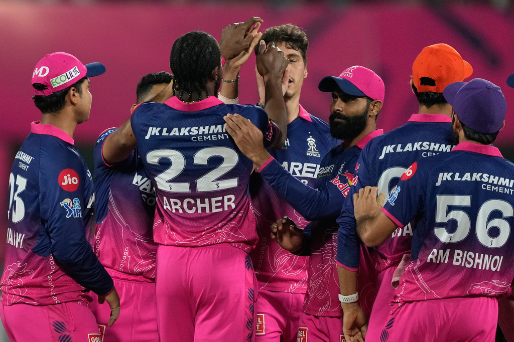Rajasthan Royals' Nandre Burger celebrates with teammates the wicket of Mumbai Indians' Suryakumar Yadav during the Indian Premier League cricket match between Mumbai Indians and Rajasthan Royals in Guwahati, India, Tuesday, April 7, 2026. (AP Photo/Anupam Nath)