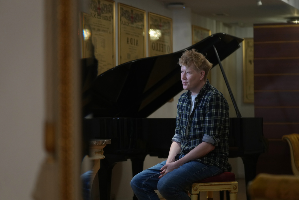 Stage director Vasily Barkhatov sits during an interview with The Associated Press prior to the dressed rehearsal of Dmitri Shostakovich's Lady Macbeth of the Mtsensk District at La Scala Opera House in Milan, Italy, Thursday, Dec. 4, 2025. (AP Photo/Antonio Calanni)