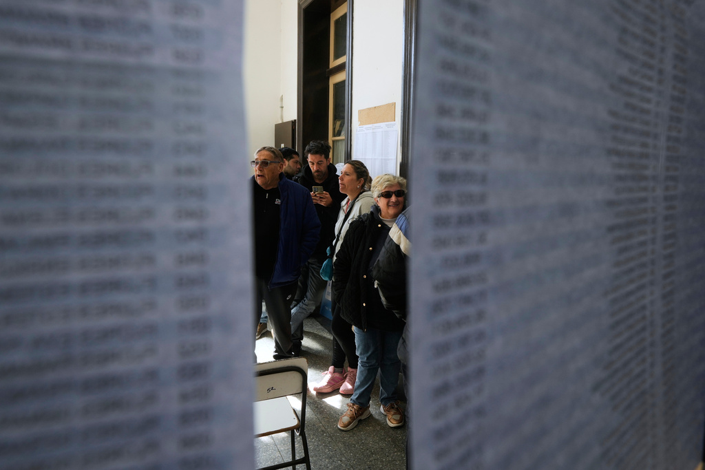 People line up to vote during legislative provincial elections in La Plata, Argentina, Sunday, Sept. 7, 2025. (AP Photo/Gustavo Garello)