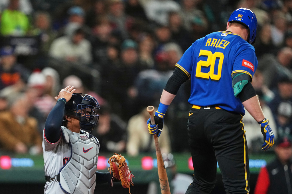 FILE - Cleveland Guardians catcher Bo Naylor challenges a call during an at-bat by Seattle Mariners' Luke Raley during the fourth inning of a baseball game, Friday, March 27, 2026, in Seattle. (AP Photo/Lindsey Wasson, filr)