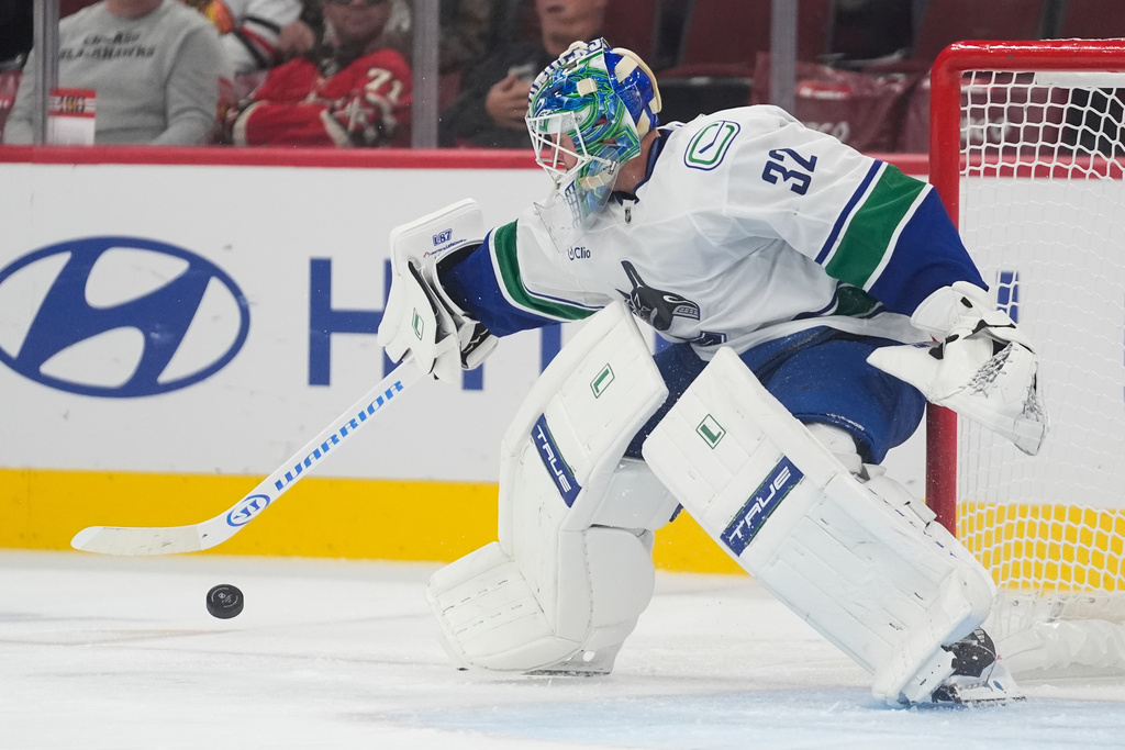 Vancouver Canucks goaltender Kevin Lankinen makes a save against the Chicago Blackhawks during the second period of an NHL hockey game Friday, Oct. 17, 2025, in Chicago. (AP Photo/Erin Hooley)