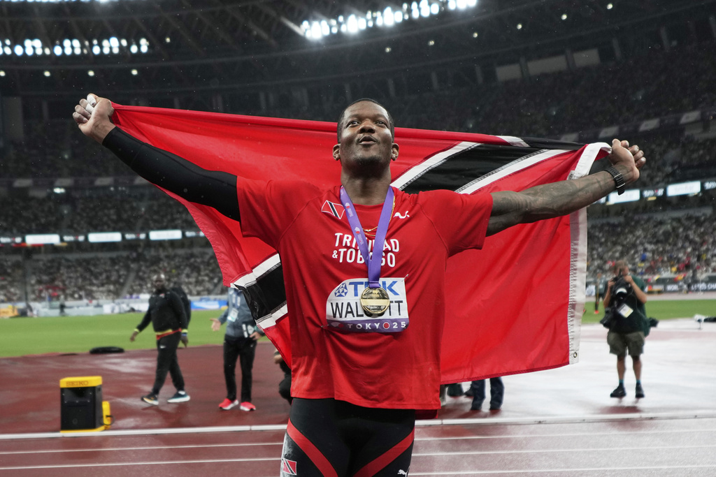 Trinidad And Tobago's Keshorn Walcott celebrates after winning gold medal in the men's javelin throw final at the World Athletics Championships in Tokyo, Thursday, Sept. 18, 2025. (AP Photo/Eugene Hoshiko)