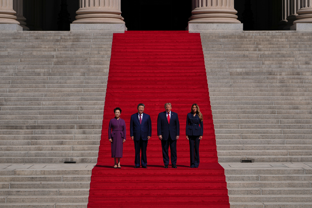 President Donald Trump, center right, first lady Melania Trump, right, China's President Xi Jinping, center left, and his wife Peng Liyuan arrive at the National Archives Museum, Friday, Sept. 25, 2026, in Washington. (AP Photo/Julia Demaree Nikhinson)