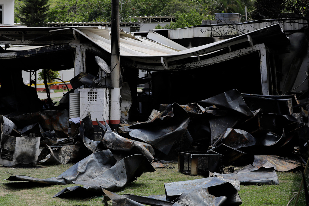 FILE - Debris from a deadly fire at the Flamengo soccer club training complex litters the ground in Rio de Janeiro, Brazil, Feb. 8, 2019. (AP Photo/Leo Correa, File)