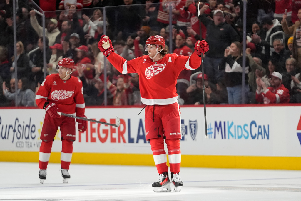 Detroit Red Wings defenseman Moritz Seider (53) celebrates his goal against the Calgary Flames in the second period of an NHL hockey game Monday, March 16, 2026, in Detroit. (AP Photo/Paul Sancya)
