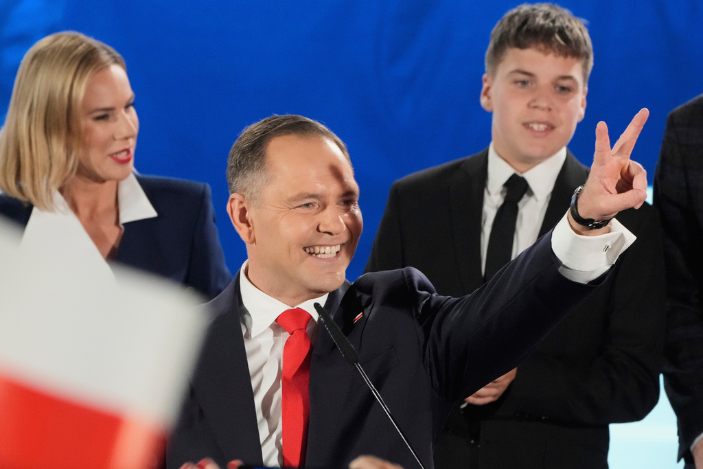 FILE - Presidential candidate Karol Nawrocki gestures at his headquarters after the presidential election runoff in Warsaw, Poland, on June 1, 2025. (AP Photo/Czarek Sokolowski, File)