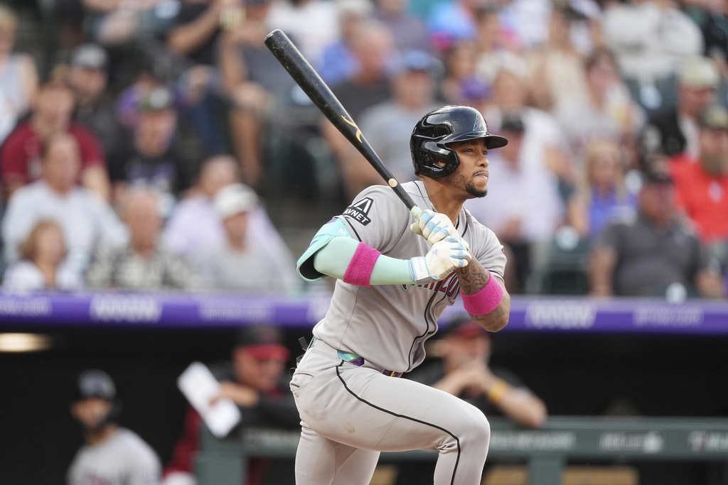 Arizona Diamondbacks' Ketel Marte grounds out against Colorado Rockies starting pitcher Bradley Blalock to end the top of the second inning of a baseball game Thursday, Aug. 14, 2025, in Denver. (AP Photo/David Zalubowski)