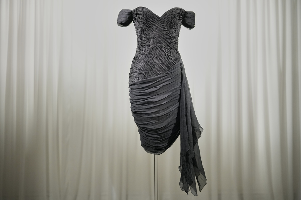 A dress worn by the late Princess Diana and known as the ''Revenge Dress'', designed by Christina Stambolian, is unveiled at Sotheby’s auction house in London, Friday, Sept. 18, 2026, ahead of its Dec. 9 auction in New York, where it is estimated to sell for US$150,000-300,000. (AP Photo/Alastair Grant)