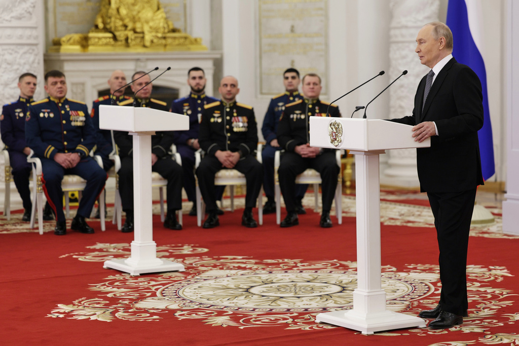 Russian President Vladimir Putin speaks prior to the awarding ceremony for Russian heroes, military and civilian, marking Heroes of the Fatherland Day at the Kremlin in Moscow, Tuesday, Dec. 9, 2025. (Gavriil Grigorov, Sputnik, Kremlin Pool Photo via AP)